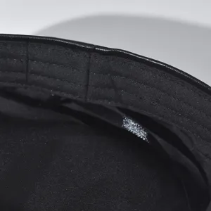 Black PU leather beret hat interior detail, premium stitching and comfortable lining.