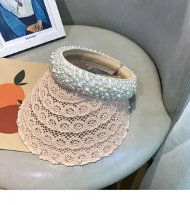 Beige pearl lace empty top sun visor, breathable French chic summer beach hat detail view.