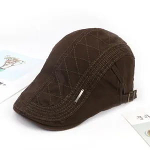 Classic men's brown flat cap with stylish diamond stitching and metal side detail for casual daily wear.
