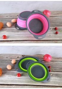 Collapsible silicone colander detail view, showing round folding fruit basket in pink and green.