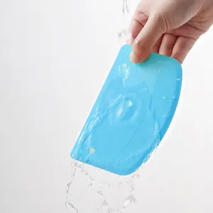 Detailed view of flexible plastic dough scraper for baking, easy cleaning bench tool.
