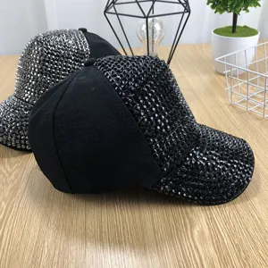 Rhinestone baseball cap detail view, sparkling crystal studded cap, stylish black hat design.