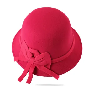 Close-up detail of the elegant rose red woolen cloche hat with a bowknot design accent.