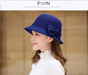 Elegant women's blue wool felt bucket hat with bow detail, stylish British fashion headwear.