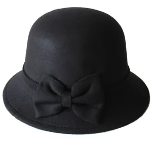 Elegant black wool bowler hat for women, classic dome cloche hat with cute bow detail.
