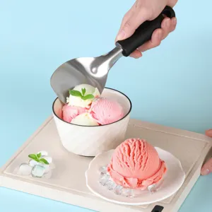 Stainless steel ice cream scoop with ergonomic black handle, perfect for commercial and home use.
