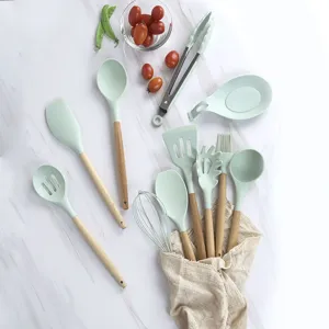 Silicone kitchen utensils set with wooden handles, heat resistant cooking spoons and spatula tools.