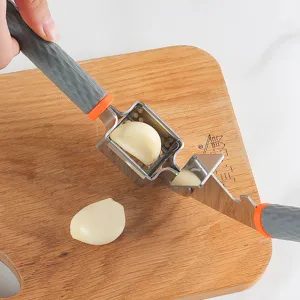 Stainless steel manual garlic press kitchen tool with ergonomic handle for easy crushing.