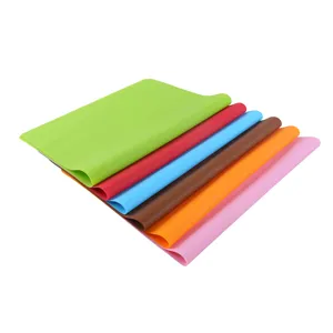 Detailed view of colorful silicone kneading mats, showing smooth texture and neat stacking design.