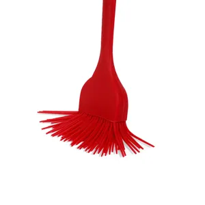 Close-up view of the fine silicone bristles and integrated handle design of the kitchen brush.
