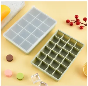 Silicone ice cube tray detail, 24-grid mold with transparent lid for home kitchen use.