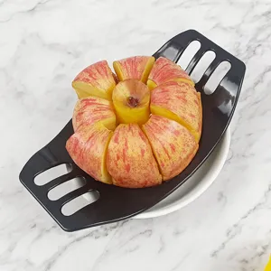Black plastic apple slicer fruit divider corer tool shown from top view with sliced apple.