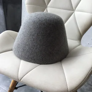 Grey wool felt bucket hat detail shot, elegant autumn winter women basin hat fashion accessory.