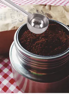 Stainless steel coffee measuring spoon with bag clip for kitchen, durable and practical.