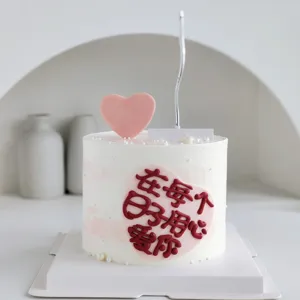 Detail shot of romantic pink heart cake decoration with loving quote for Qixi Valentine's day.