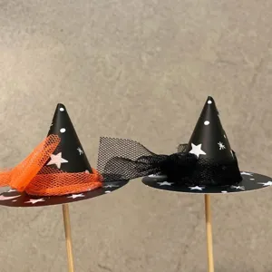 Halloween witch hat cake toppers with mesh decoration, perfect for spooky party food decor.