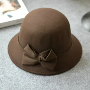 Brown wool felt dome bucket hat detail with elegant bow, autumn winter retro british style.