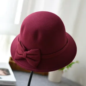 Wine red dome felt bucket hat detail, elegant bow decoration for autumn and winter.