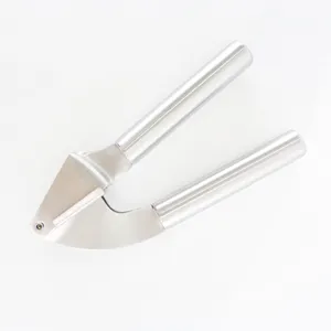 Stainless steel garlic press detail view, kitchen gadget for easy food prep, durable metal tool.