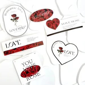 Valentine day paper cake toppers set with romantic red roses and elegant love typography designs.