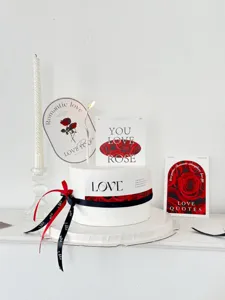 Valentine's day cake decoration details, romantic rose cards, inserts, and decorative ribbons.