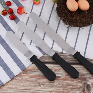 Stainless steel offset icing spatula set with ergonomic black plastic handles for baking.
