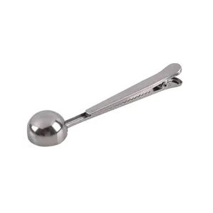 Stainless steel coffee scoop with sealing clip, durable kitchen measuring spoon for powder.