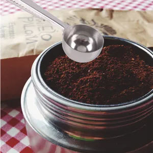 Stainless steel coffee measuring spoon with clip, durable tool for coffee and milk powder.