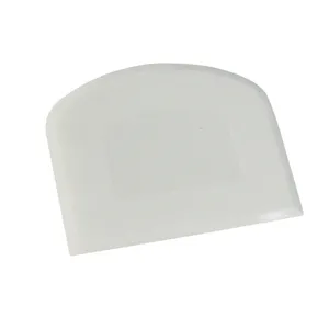 White PE plastic dough scraper, cake cutter and baking tool for kitchen pastry making.