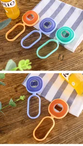 Silicone multi-functional bottle opener with gear design, anti-slip kitchen tool detail.