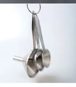 Stainless steel mini funnel set detail showing three nested kitchen funnels hanging on a ring.