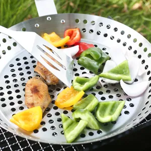 Stainless steel round perforated barbecue grill pan with handle for outdoor camping and BBQ.