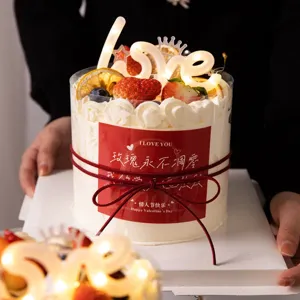 Valentine cake decoration set with light up LOVE topper and romantic cake sticker wrapper.