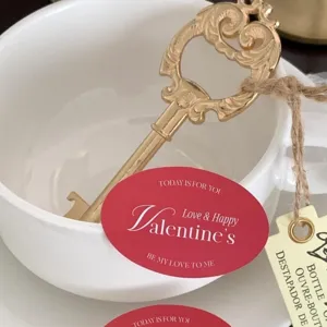 Vintage gold key bottle opener with romantic Valentine theme tag for party gift and decor.