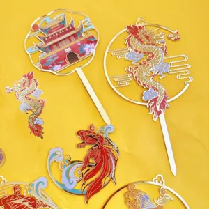 Close-up detail of Chinese style acrylic cake toppers featuring traditional dragon and koi fish.