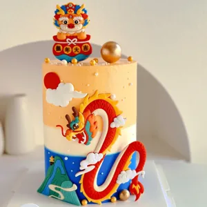 Details of 2024 Chinese Year of the Dragon cake decoration, soft rubber dragon topper setup.