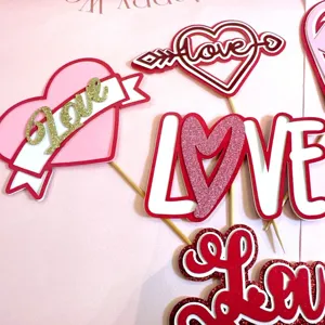 Valentine day paper cake topper set, pink red love heart designs for dessert decor detail view.