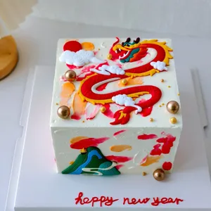 Details of the 2024 Chinese Year of the Dragon cake decoration, featuring red dragon and clouds.