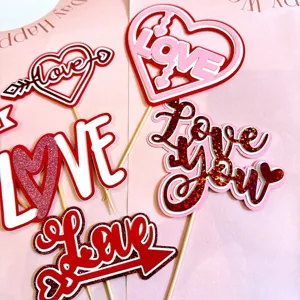 Valentine's day paper cake toppers set with love hearts and cute arrows for party decoration.