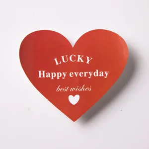 Red heart shaped card sticker with greeting text for Valentine Day cake decoration.