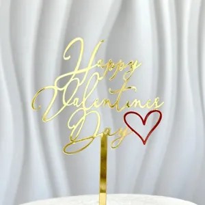 Gold acrylic Happy Valentine's Day cake topper detail close up with red heart decoration
