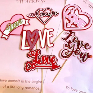 Valentine's Day pink paper cake toppers set with love heart designs for romantic party decor.