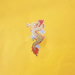 Chinese style dragon acrylic cake topper detail, traditional festive decoration for party desserts.
