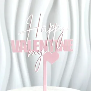 Closeup shot of pink and white acrylic cake topper featuring sweet Valentine design.