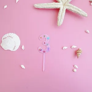 Pink acrylic number 3 cake topper detail with ocean seashell styling for birthday party decor