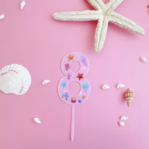 Pink acrylic number 8 cake topper with ocean sea shell starfish design for birthday party decor.