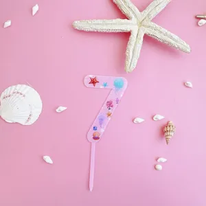 Pink acrylic number 7 cake topper with ocean shell and starfish theme for birthday party decor.