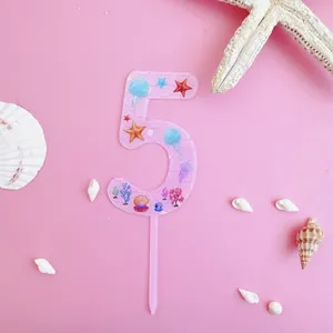Pink number 5 acrylic cake topper with ocean shell and starfish print for birthday party.