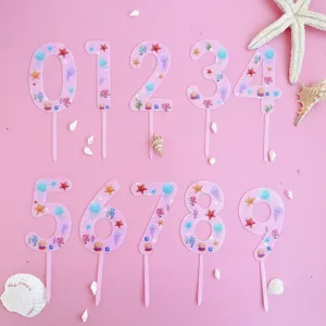 Pink acrylic number cake toppers 0-9 with ocean starfish and shell design for birthday party.