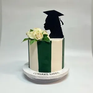 Acrylic black graduation cake topper, elegant female silhouette design for party decor.